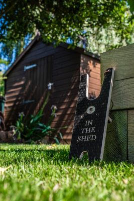 Boot jack by a garden shed.