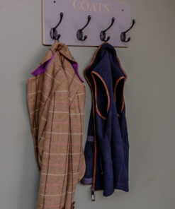 Grey wall mounted coat rack with black hooks and engraving of coats. option of personalisation