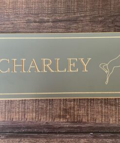 grey smooth wooden name sign with a jumping horse