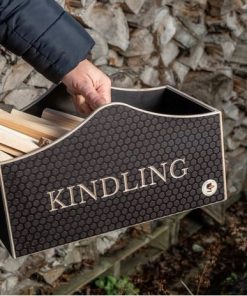 Wooden kindling box held in front of a log store