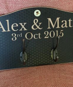 Coat rack personalised with the names Alex & Matt & Date they met