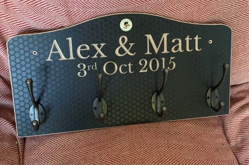 Coat rack personalised with the names Alex & Matt & Date they met