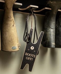 Boot Jack hanging on a wall mounted welly rack