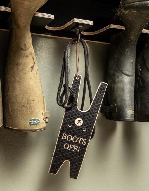 Boot Jack hanging on a wall mounted welly rack