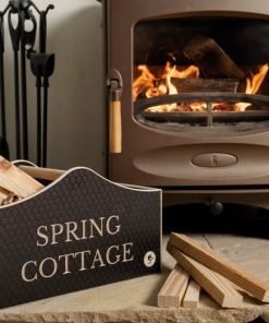 personalised kindling box next to a log burner