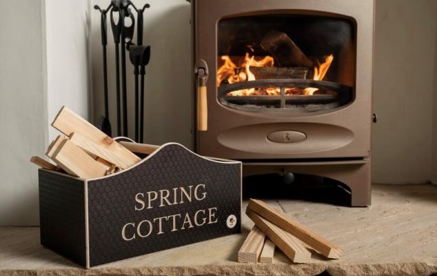 personalised kindling box next to a log burner