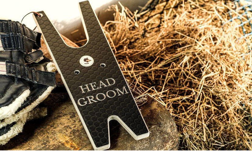 Wooden engraved boot puller enraved with head grrom