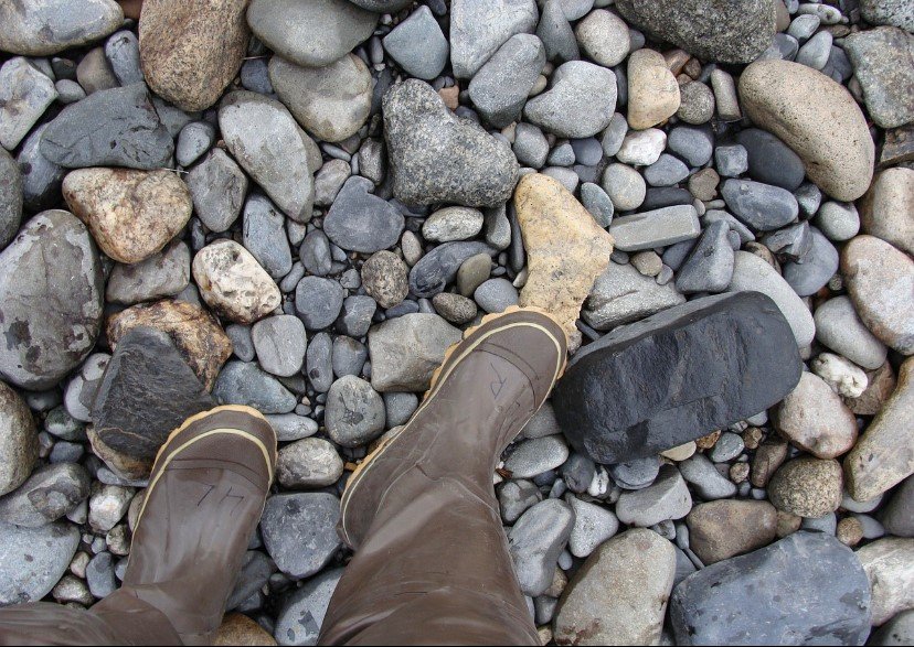 Welly boots on a pebble beach