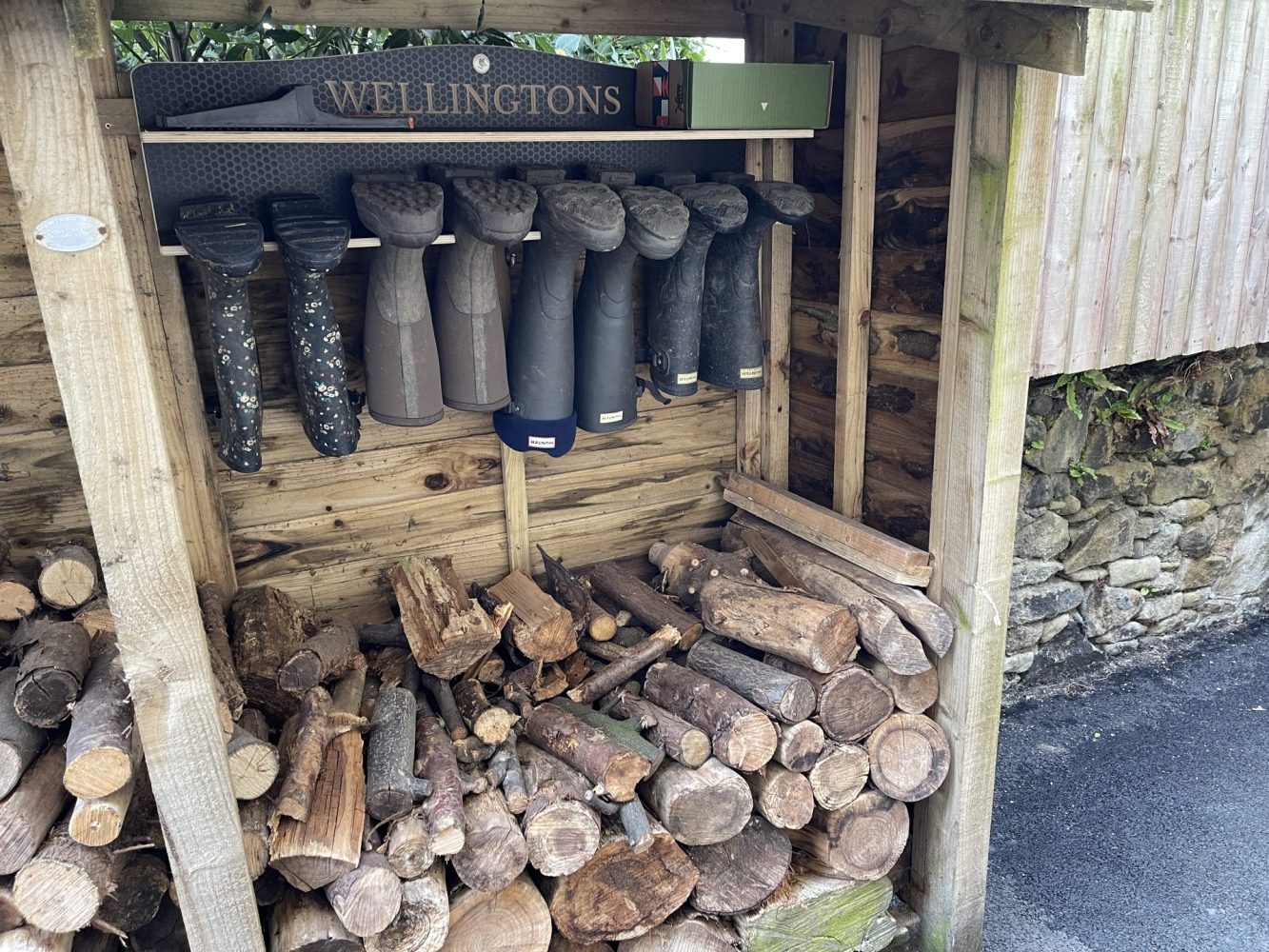 Here a Log shed used for welly storage, but the roof can also be used for water harvesting