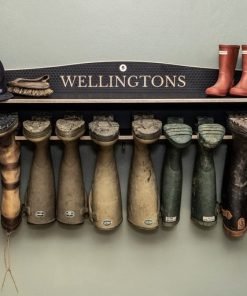 wellington boot rack hung on a wall as storage solution for welly boots