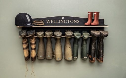 wellington boot rack hung on a wall as storage solution for welly boots