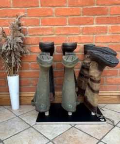 Welly rack stand holding 3 wellies on a plain brown base with wooden poles