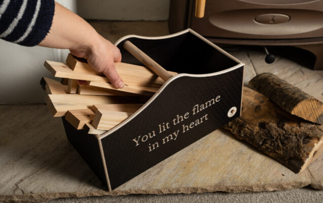 A unique valentine's gift of a woodn engraved kindling holder with a romantic phrase.