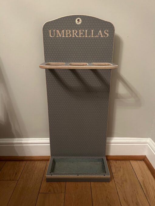 A practical present for valentine's day a wooden engraved umbrella stand.