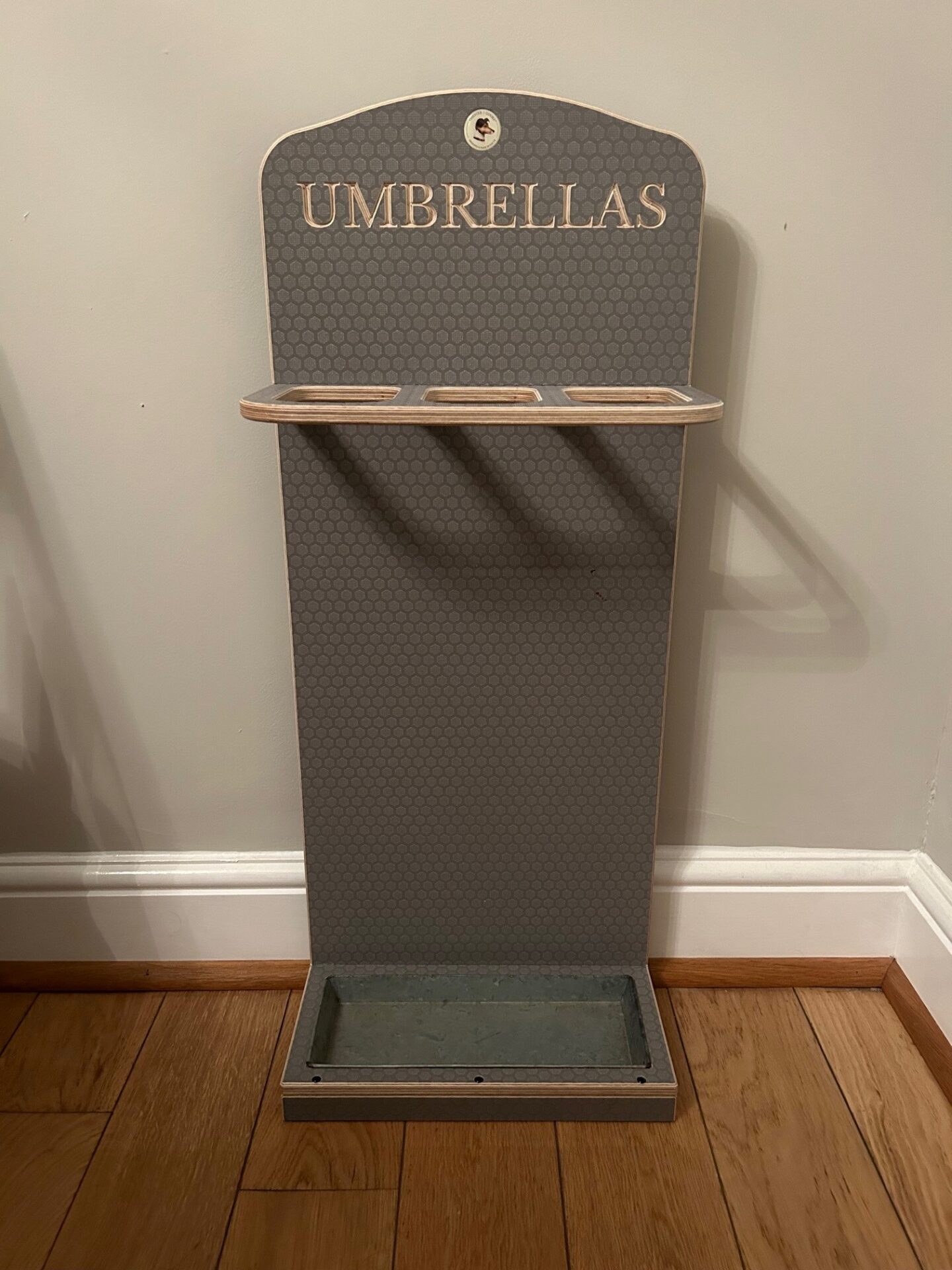 A practical present for valentine's day a wooden engraved umbrella stand.