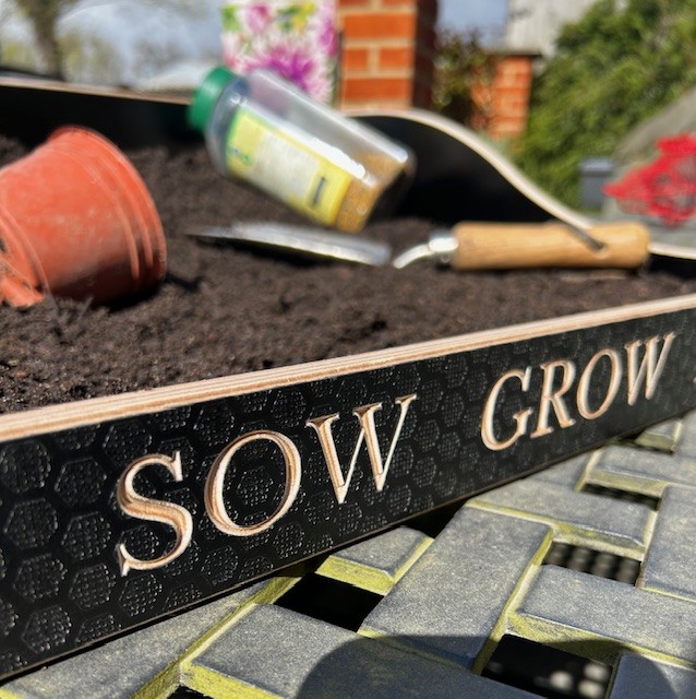 make sowing and replanting pots easy with a custom gardening tray