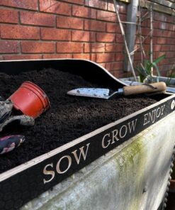 engraving close up on this wooden potting tray