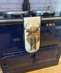 highland cow oven mitts on a navy aga
