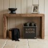 Wooden boot box that is personalised with Kate's boot, under a hall table