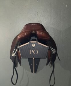 wooden saddle rack with saddle on